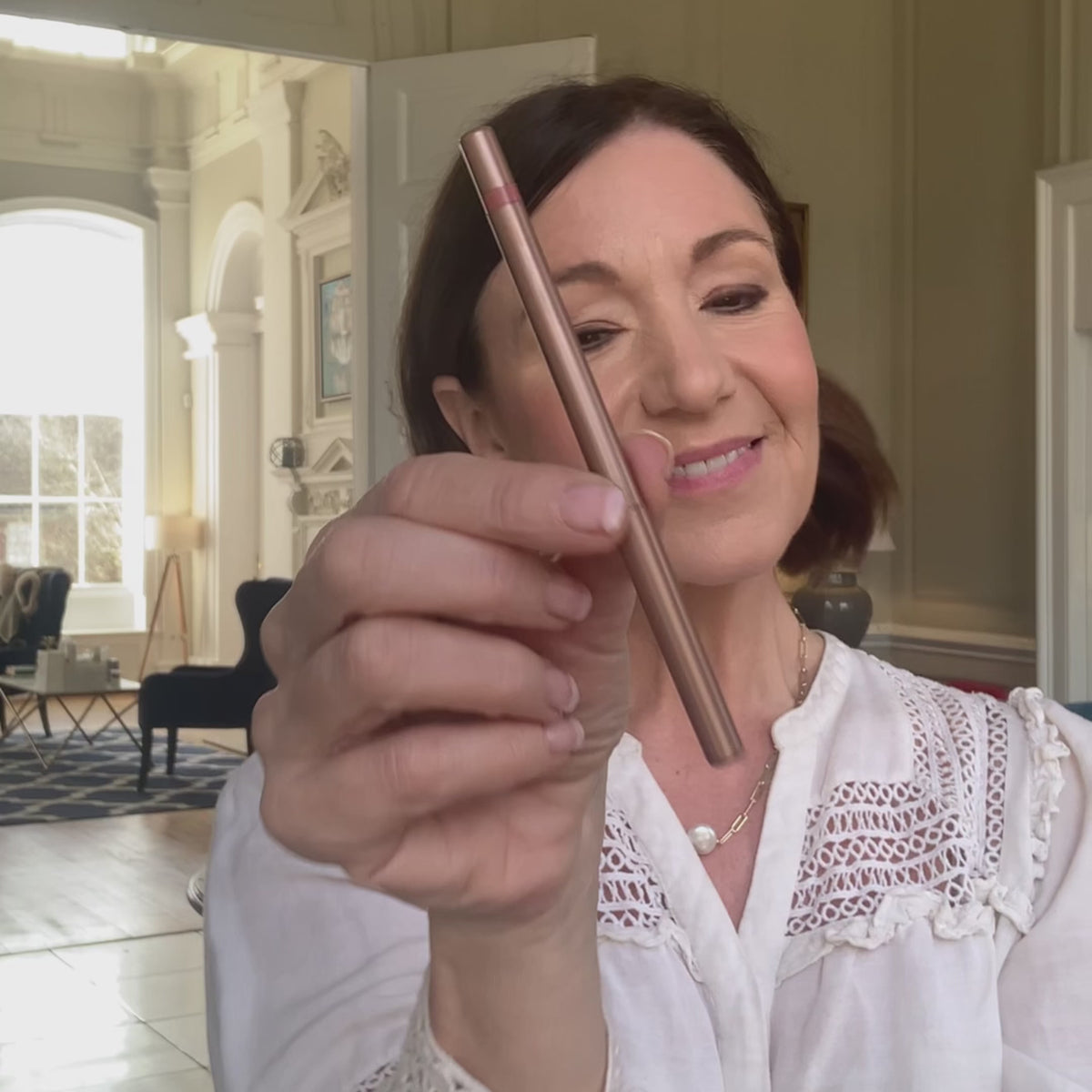 Load video: Video: woman showing a delilah cosmetics lip pencil from the Nude Lip Wardrobe